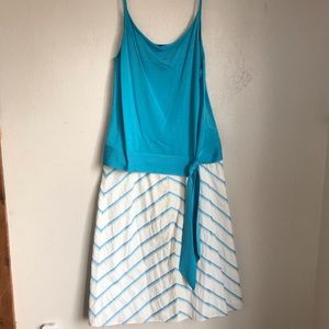 Turquoise tank and A line skirt.